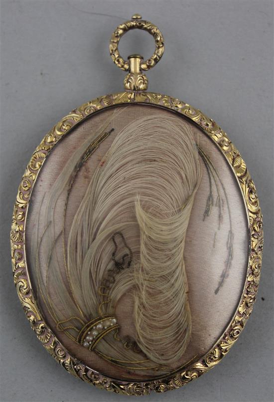 An oval Victorian daguerreotype mourning pendant, overall 3.25in. including hanging loop